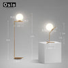 Lampadaire design à LED doré avec boule en verre