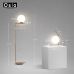 Lampadaire design à LED doré avec boule en verre