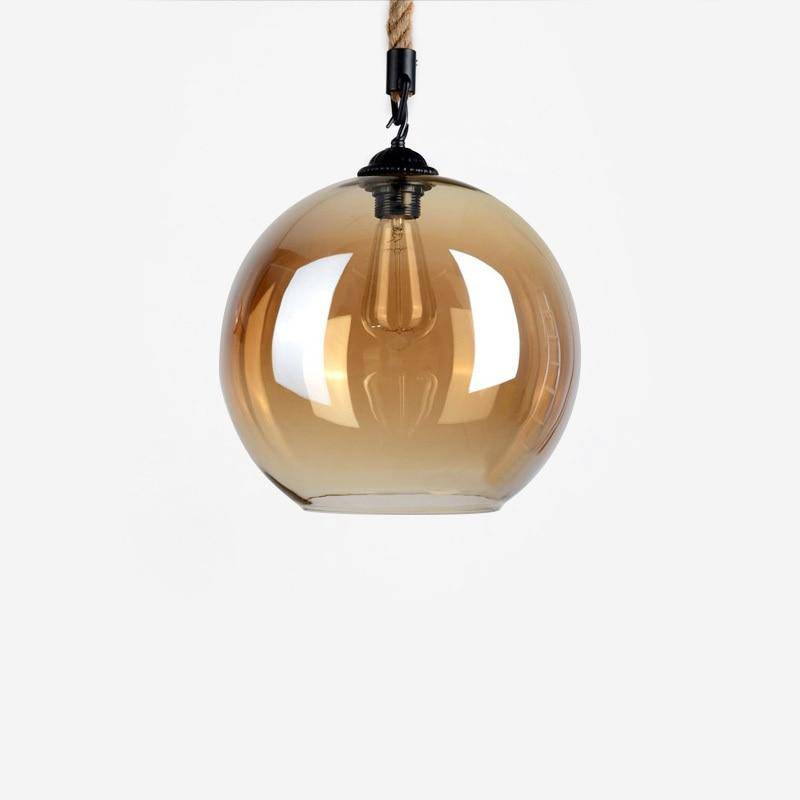 Suspension design boule en verre ambré sur corde Decor