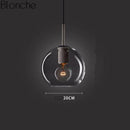 Suspension design LED en verre arrondi au style Loft Industriel