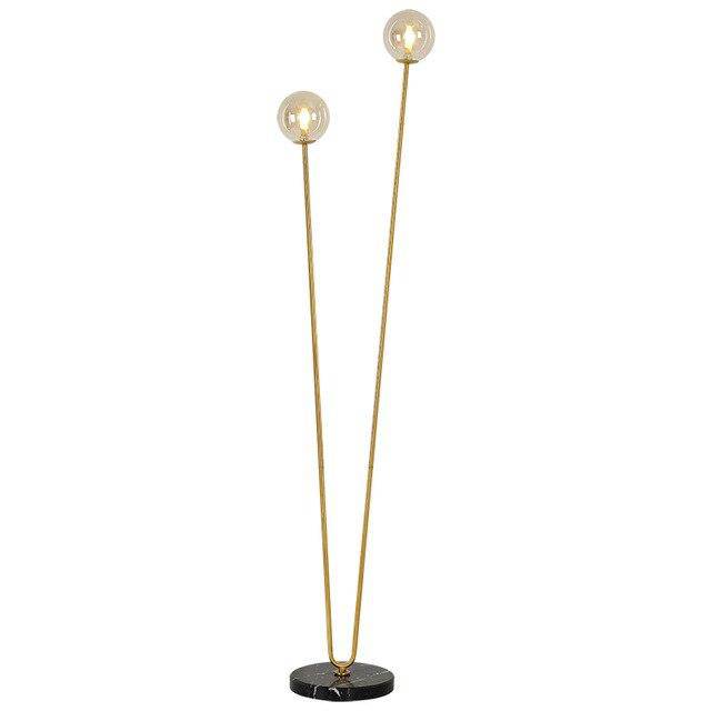 Lampadaire design avec deux branches doré et boules en verre