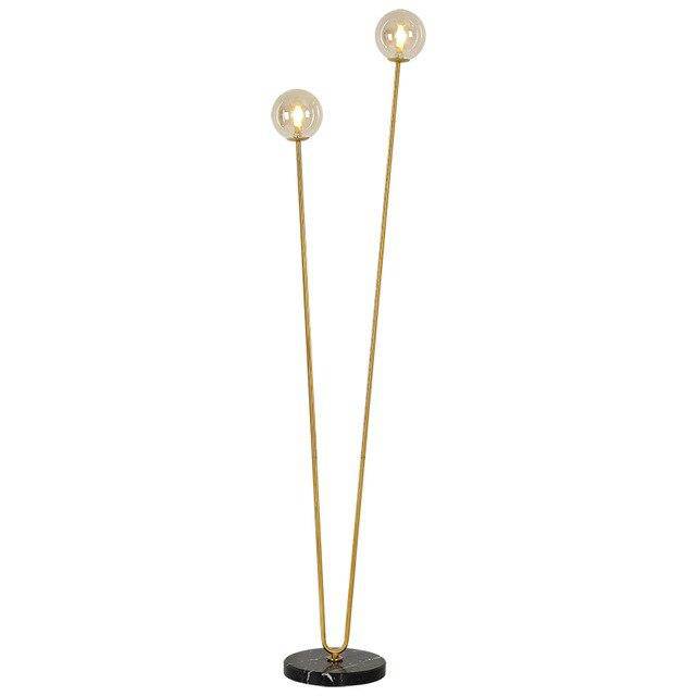 Floor lamp design with two golden branches and glass balls