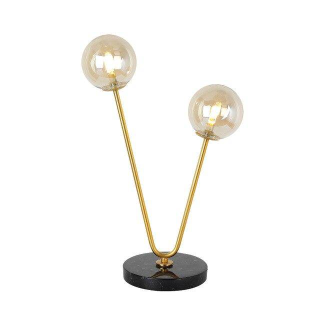 Lampe de chevet design avec deux branches doré et boules en verre