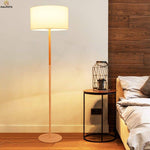 Floor lamp with lampshade fabric and wooden base