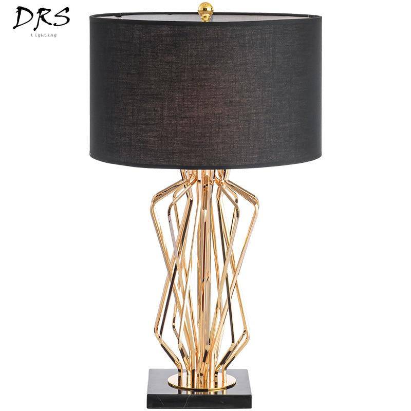 Bedside lamp with gold design stand and lampshade in fabric