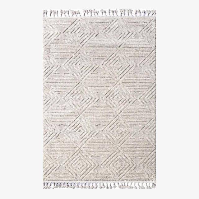 Rectangular white Berber carpet with raised check pattern and fringes