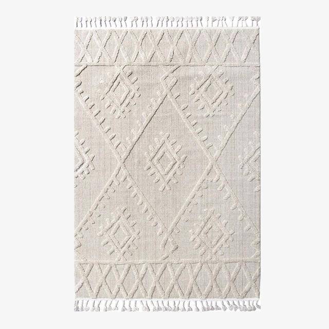 White Berber rectangle carpet with raised patterns and fringes