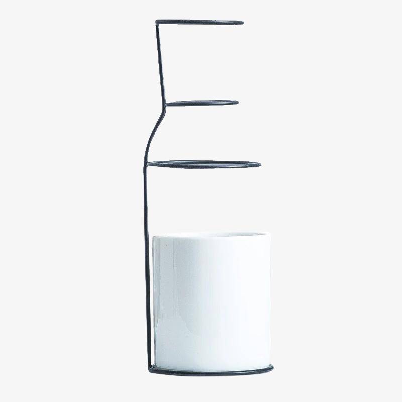 Scandinavian ceramic design vase with metal sticks